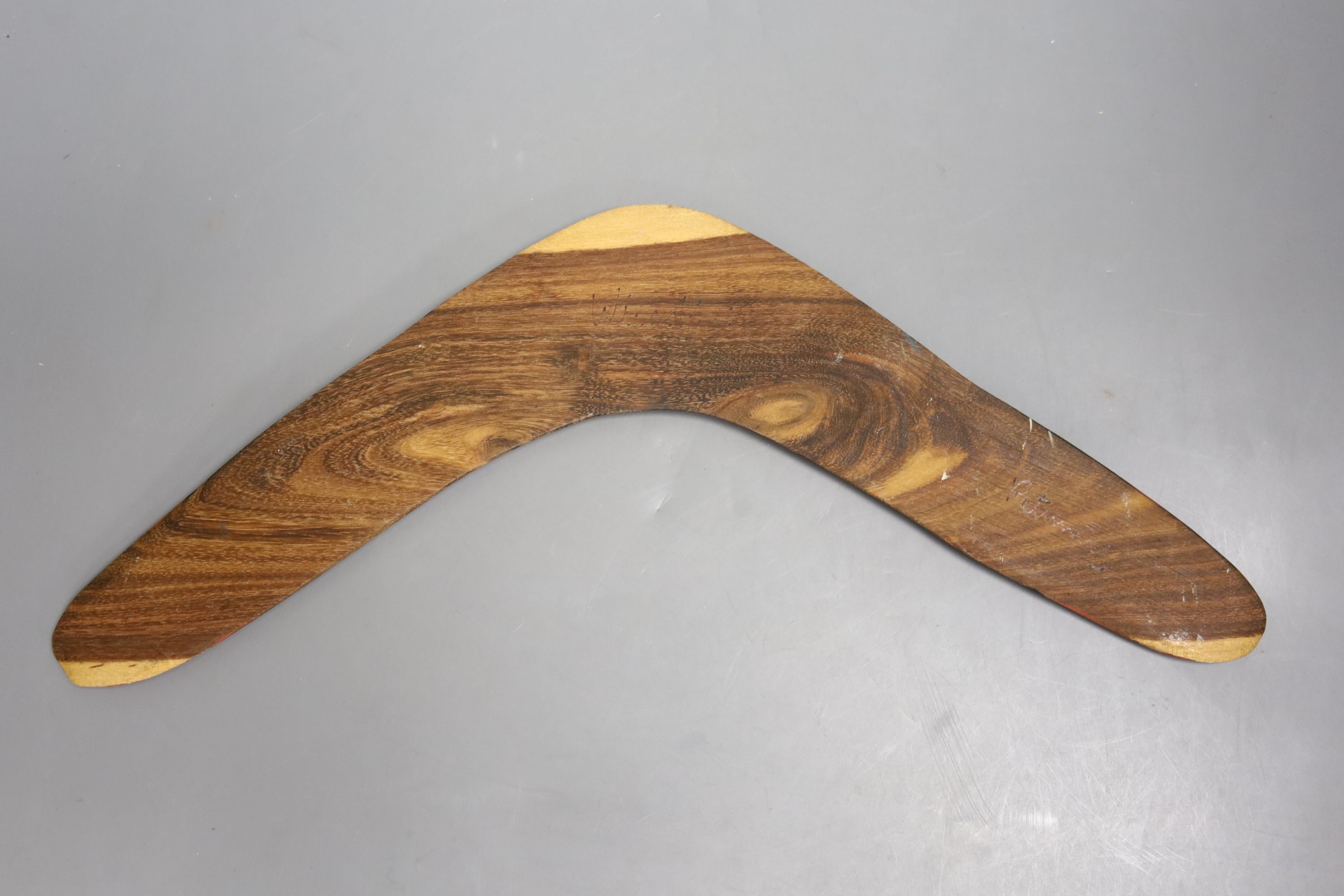 An Aboriginal returning boomerang, width 42cm